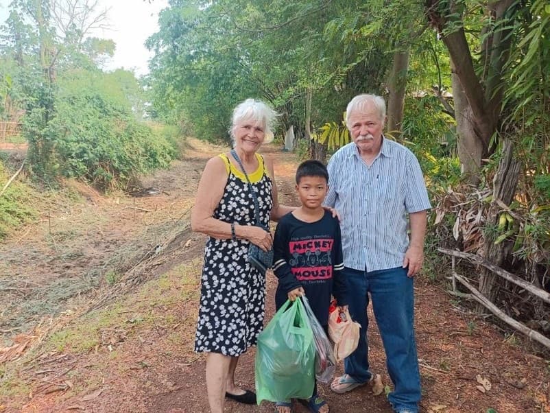 Kathleen and Randy McReynolds with one of the kids