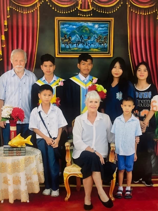 Graduation day: Randy and Kathleen with the kids in school uniforms